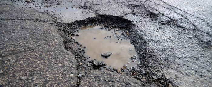 What happens to your car when you hit a pothole?